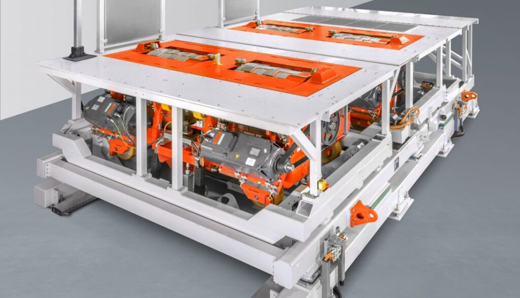An orange and white machine is sitting on a table.