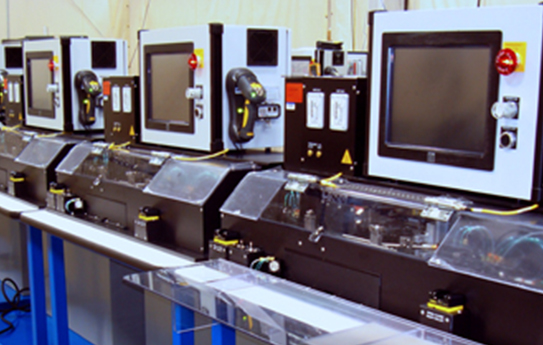 A row of machines in a room.