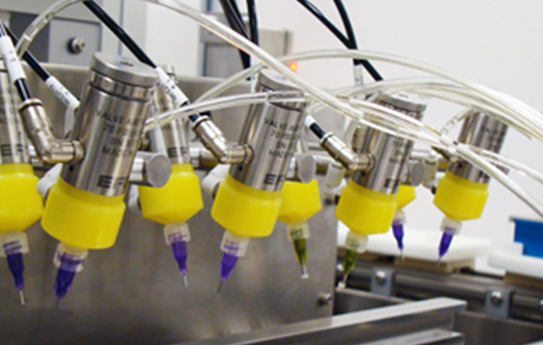 A machine with yellow and yellow hoses.