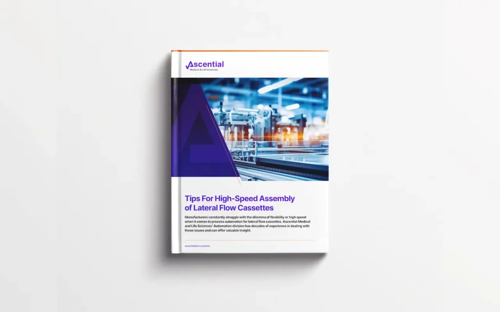 A brochure on a white surface titled "Tips For High-Speed Assembly of Lateral Flow Cassettes" by Ascential, featuring an image of manufacturing equipment and a large "A" graphic element.