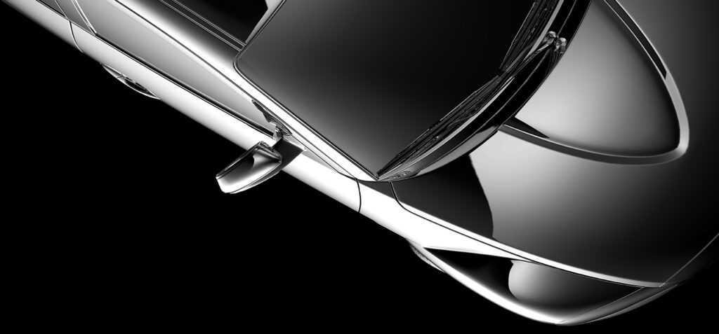 Overhead view of a sleek, modern car emphasizing its aerodynamic design and smooth metallic surface.