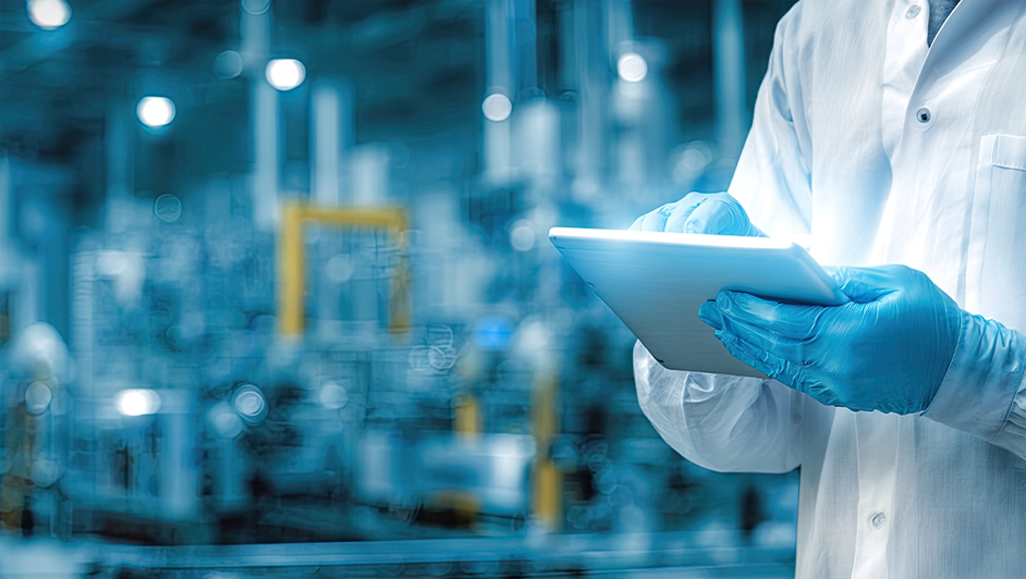 Scientist using tablet in high-tech lab.